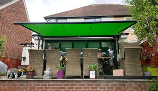 Green canvas awnings over patio - Cyra Group Ltd