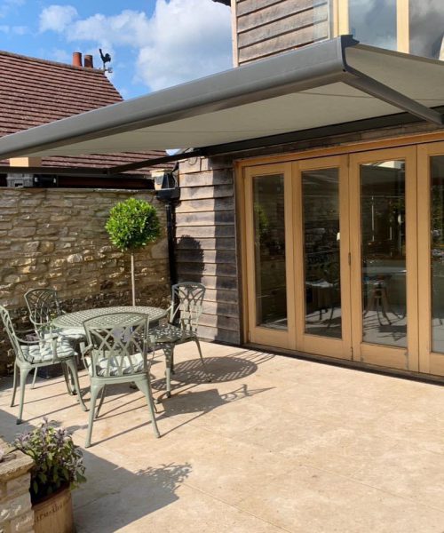 Retractable awning over patio
