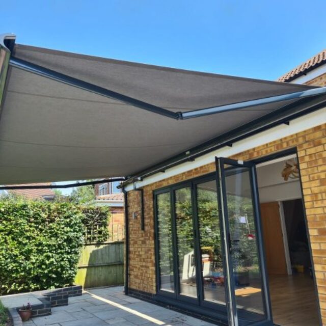 Grey awnings above bifold doors