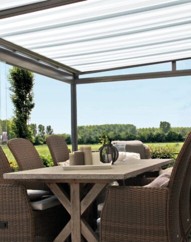 Glass room with dining table and chairs