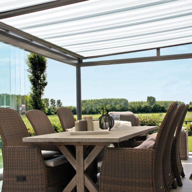Glass room with dining table and chairs