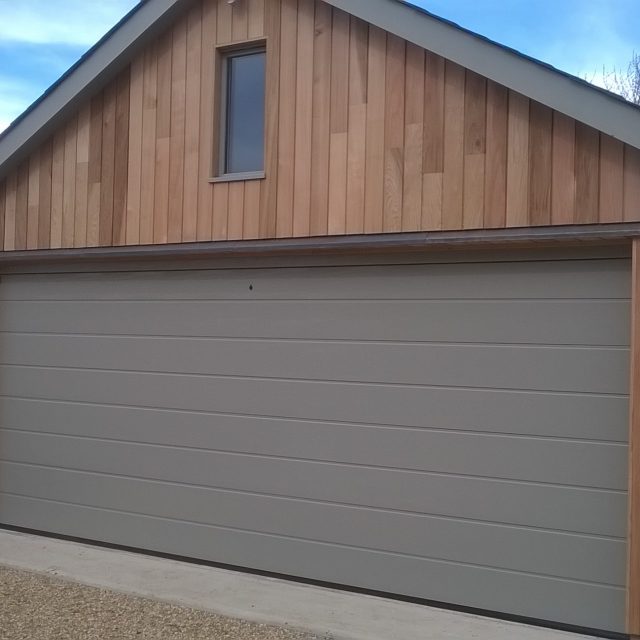 Large double, grey sectional garage door