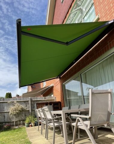 Dark green awning.